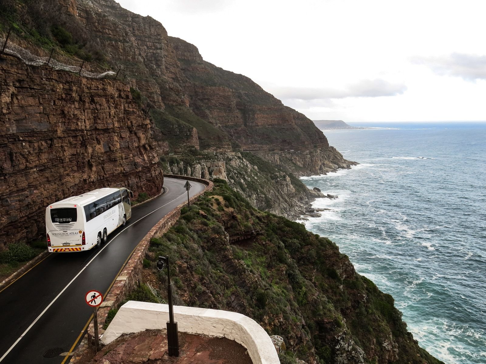 Modern coach on a scenic South African coastal route